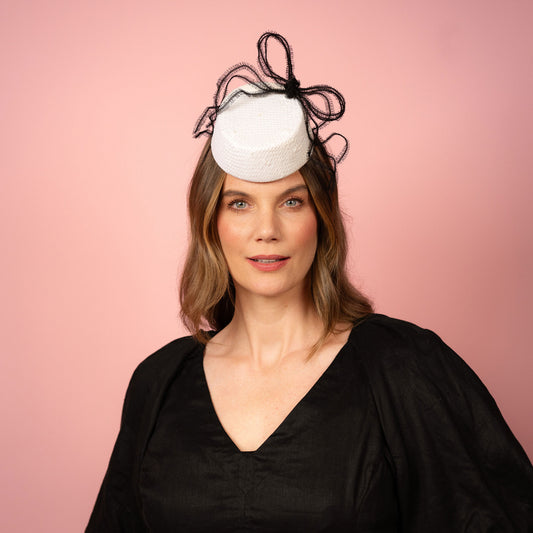 Alana percher pillbox in white straw with black crinoline bow Spring Racing Headpiece
