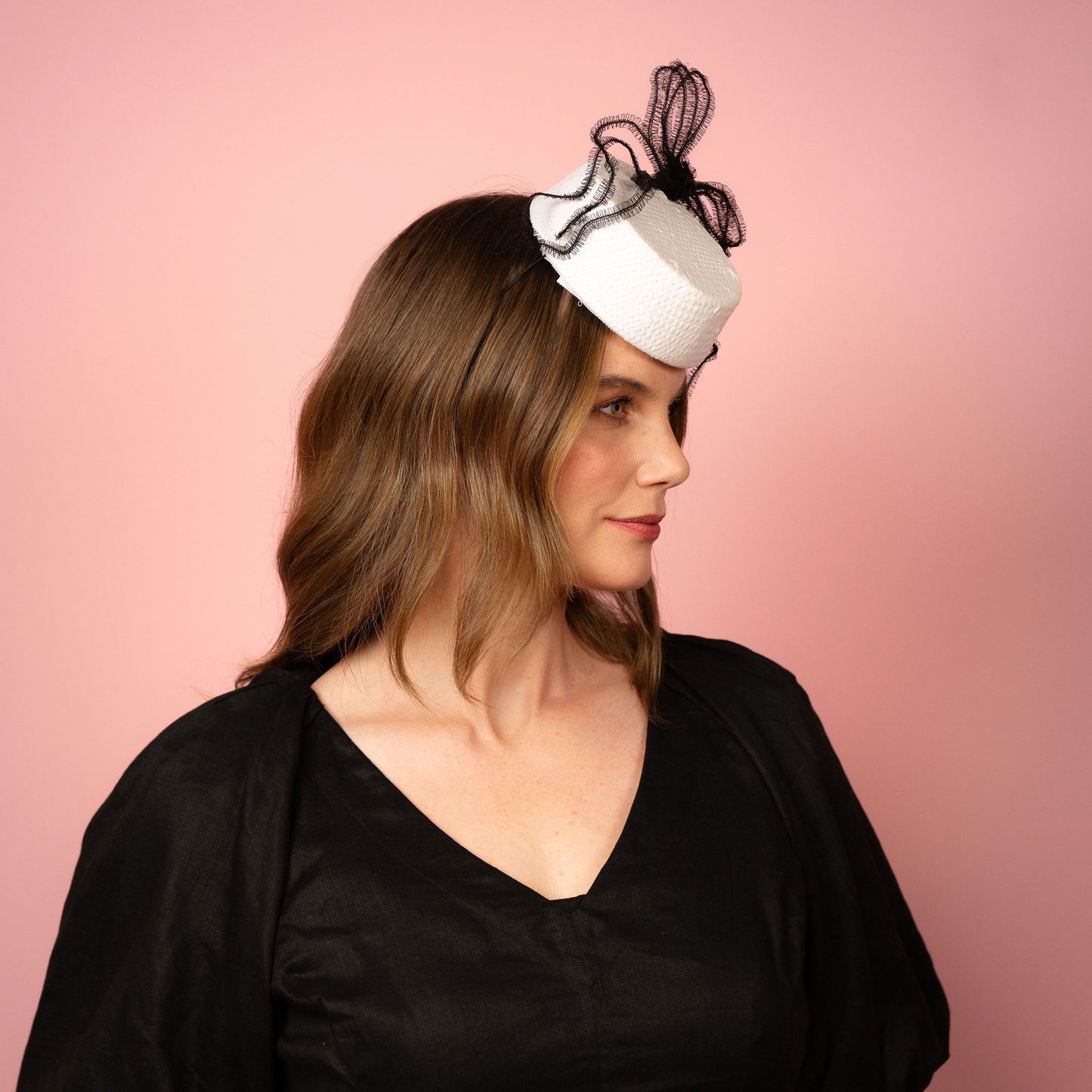 Alana percher pillbox in white straw with black crinoline bow Spring Racing Headpiece