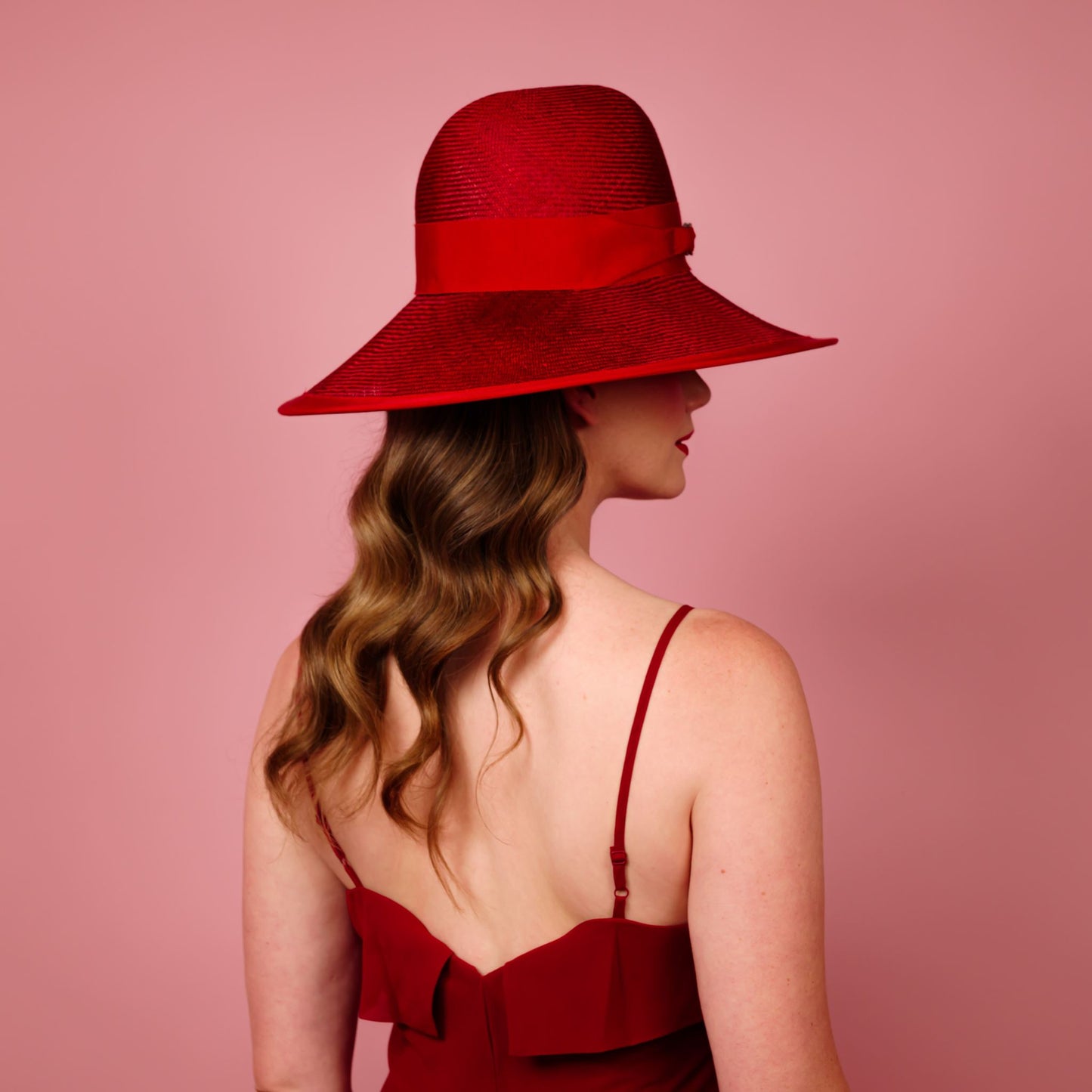 Charlotte wide brimmed hat with shaped crown in red straw and silver buckle