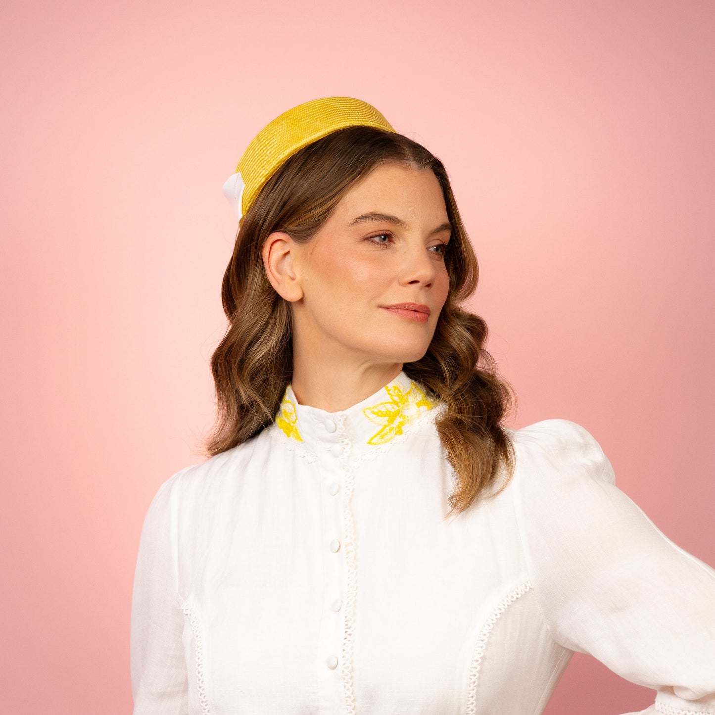 Peggy Pillbox in yellow straw with white petersham infinity bow Spring Racing Headpiece