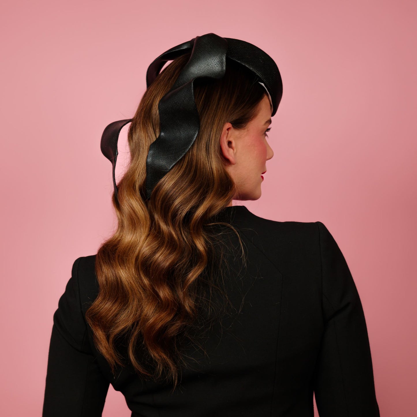 Zenith percher shaped straw headpiece with sculpted tails in black