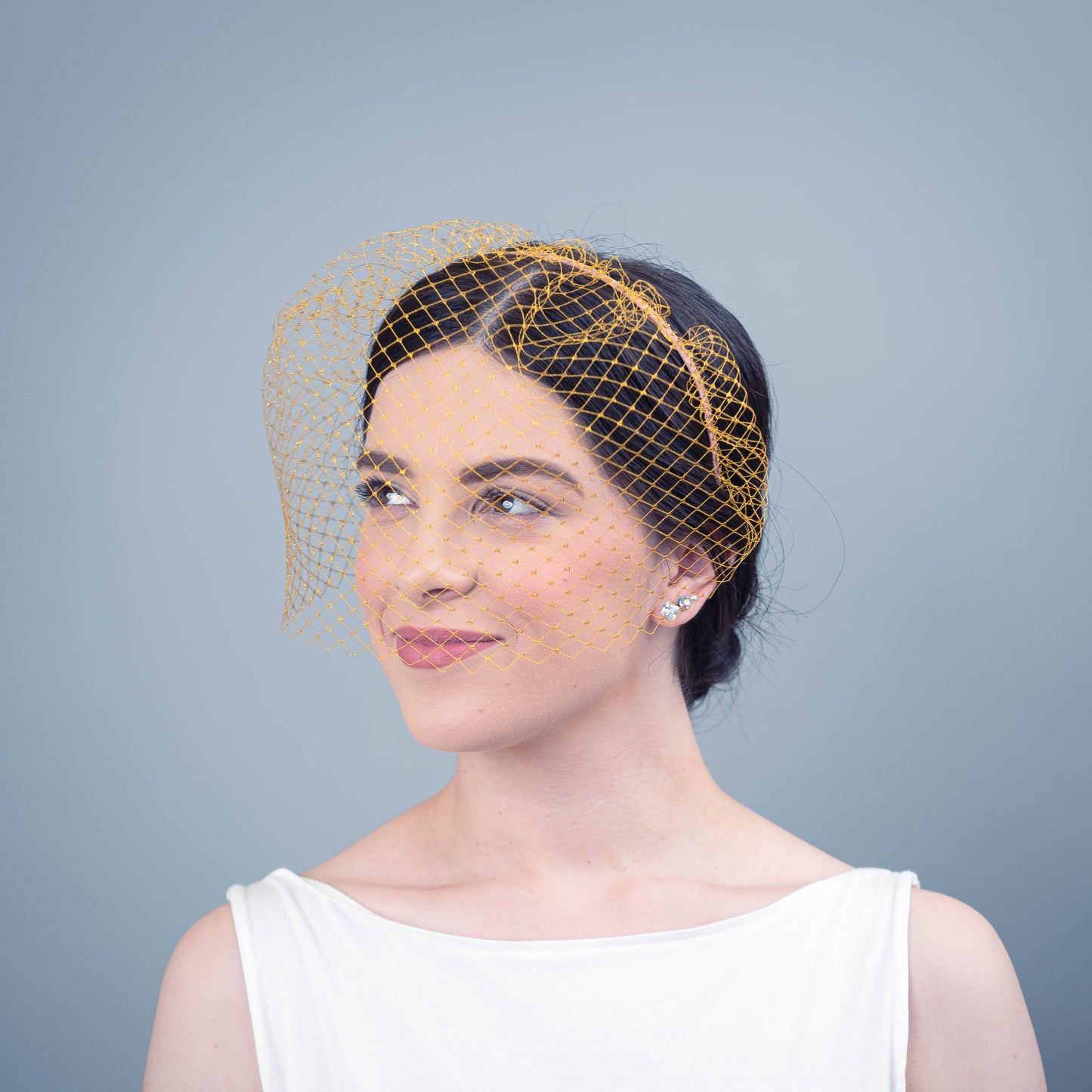 All of Me bridal birdcage veil on headband in gold veiling